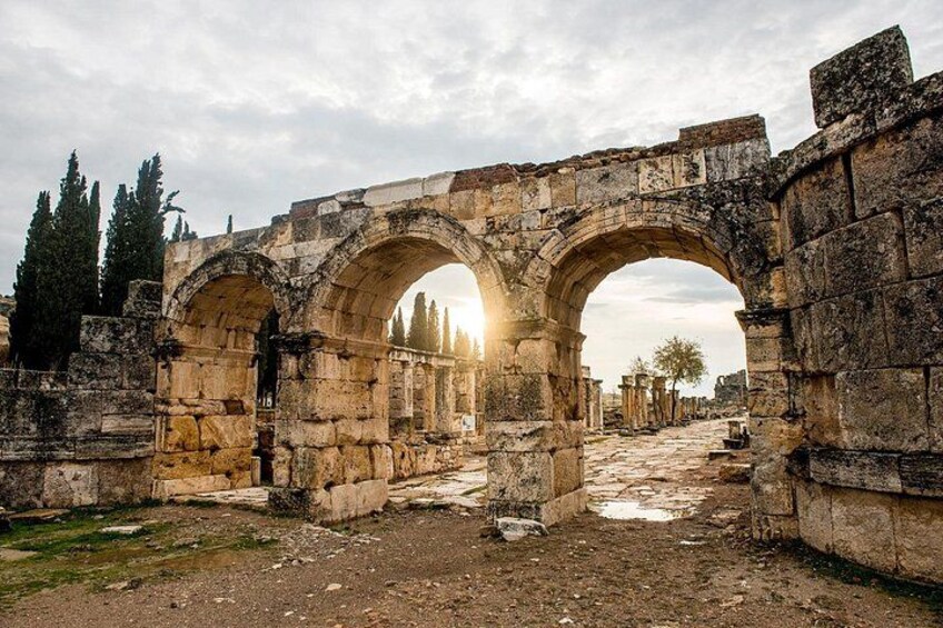 Ancient stone arches, ruins, and trees. 3