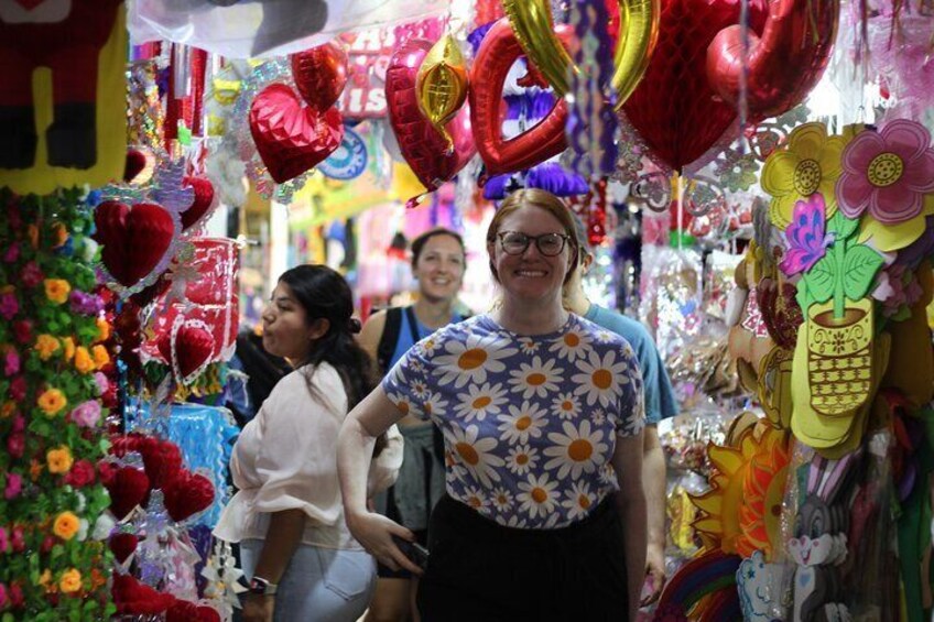 A market with colorful balloons and flowers. 3