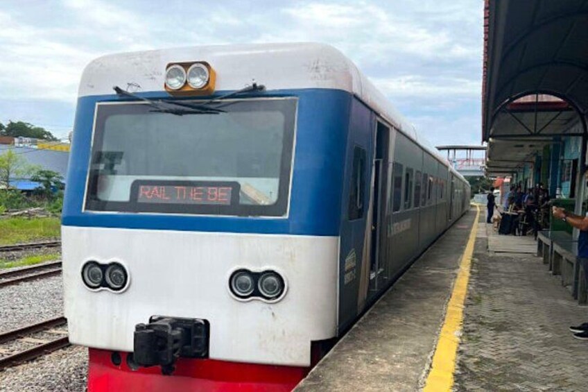 A train at a station platform with a clear sky. 4