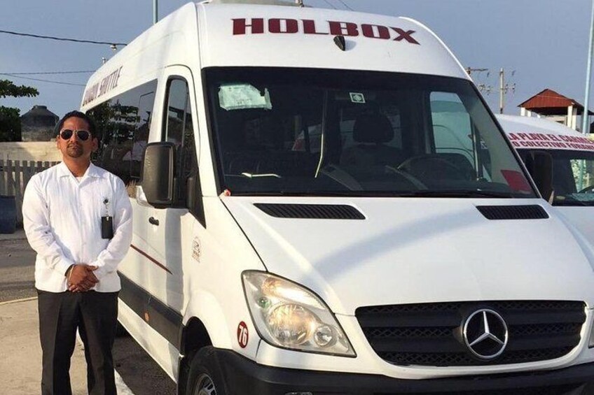 A white Mercedes-Benz van with the word "HOLBOX" on the front. 1