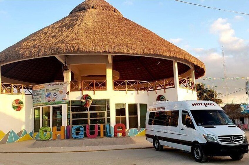 A building with a thatched roof and a sign reading "FREDDIE'S". A white van is parked in front. 4