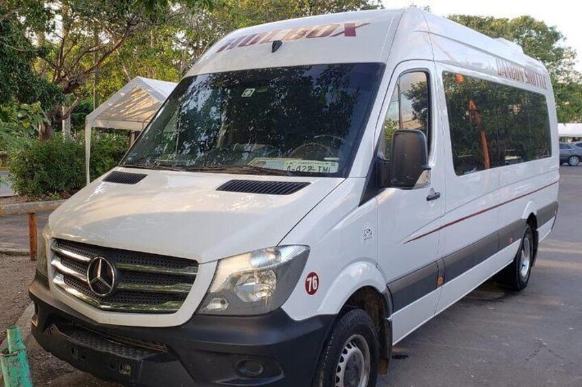 A white Mercedes-Benz Sprinter van parked outdoors. 2