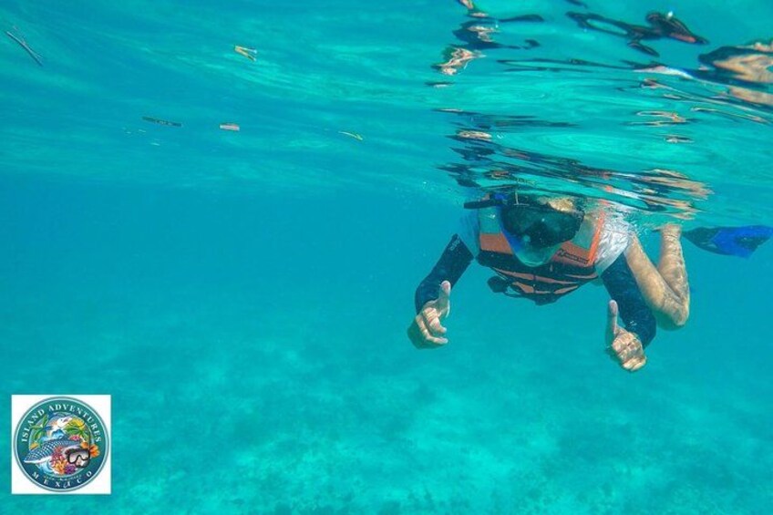 A person swimming underwater with fins. 2