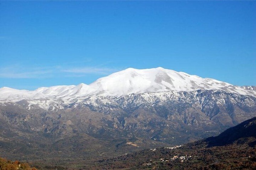 A snow-capped mountain range with a clear sky. 3