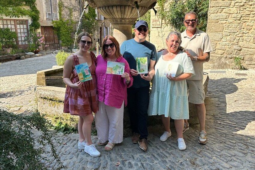 A group of people standing outdoors, holding books. 3