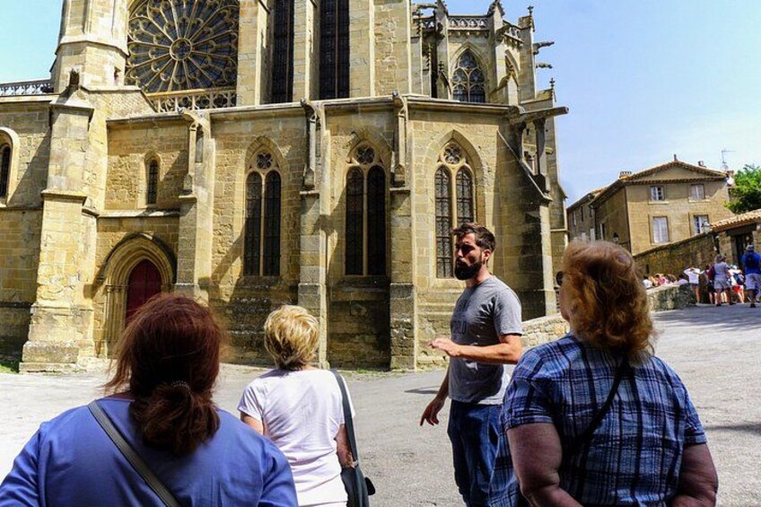 A historic church with Gothic architecture, including pointed arches and a large rose window. 4