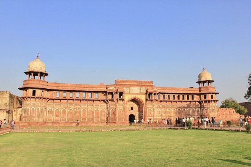 A large, historic building with domed towers and arched gateways. 5