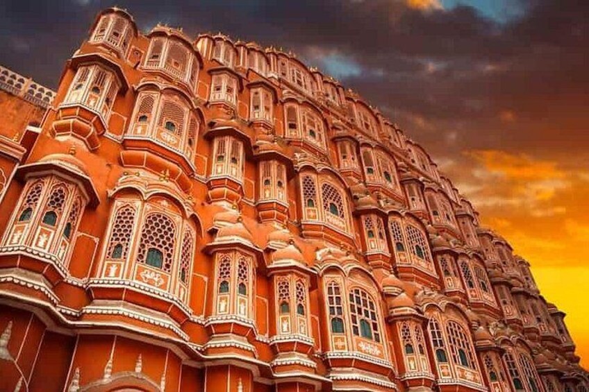 A grand, ornate building with intricate architectural details and multiple windows. 2