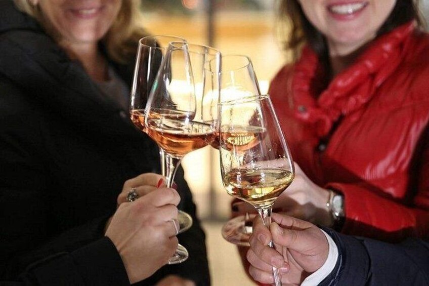 A person holding a wine glass. 3