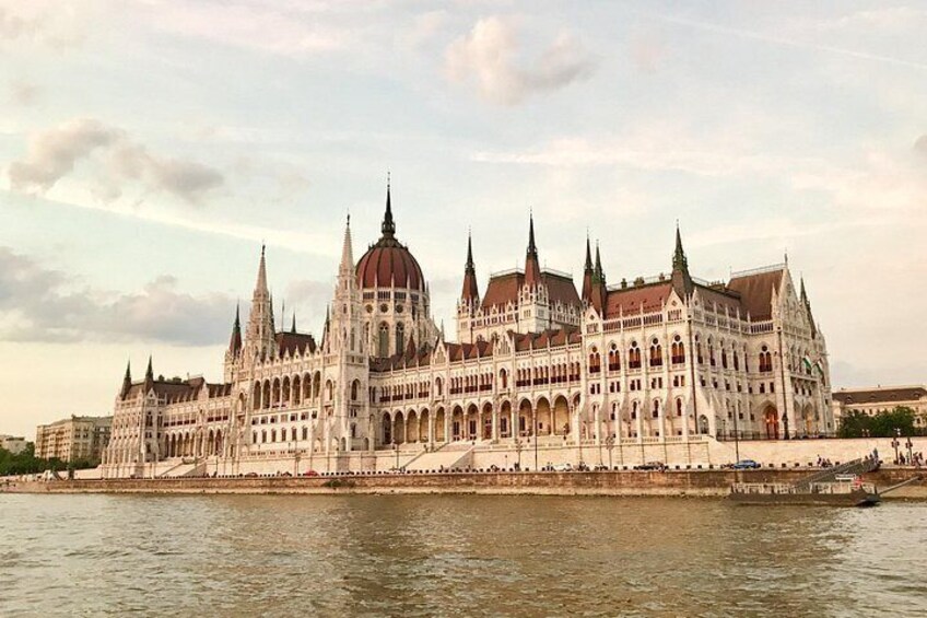 A large, ornate building with multiple spires and domes, situated by a body of water. 5