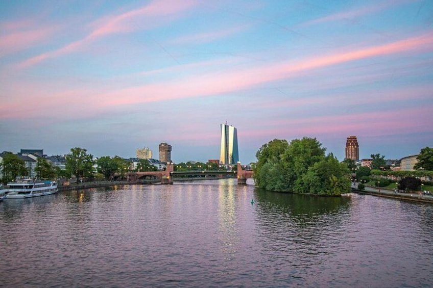 A river with buildings and trees in the background. 4