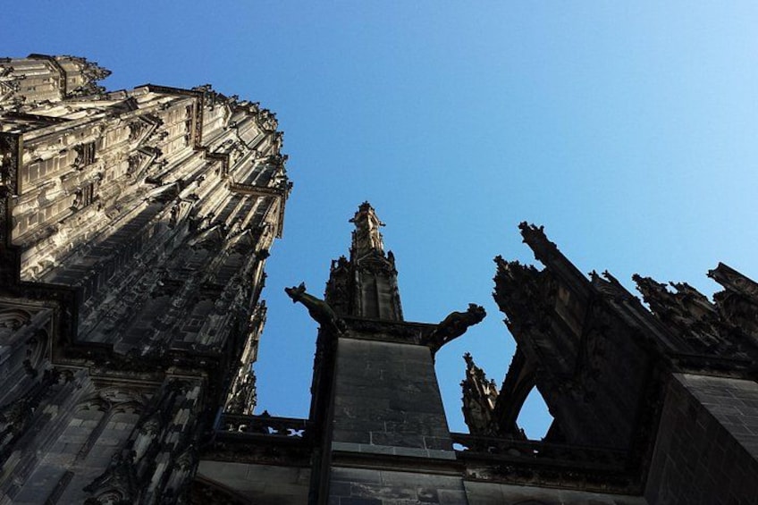 A ruined historical building with intricate stonework and a statue in the center. 3