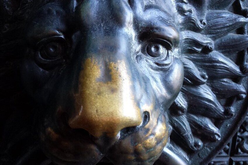 A close-up of a bronze sculpture with intricate details. 4
