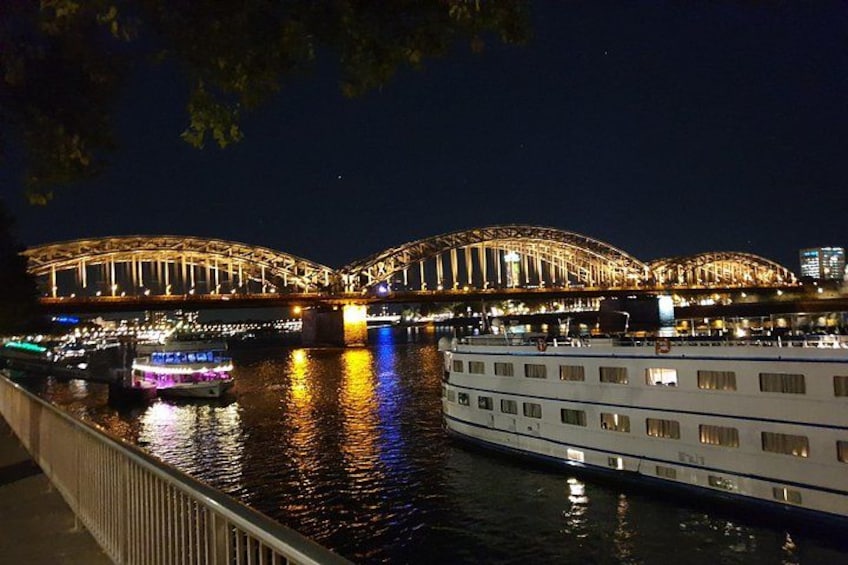 A river with a bridge and boats. 4