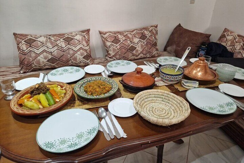 A dining table set with various dishes, plates, and utensils. 4