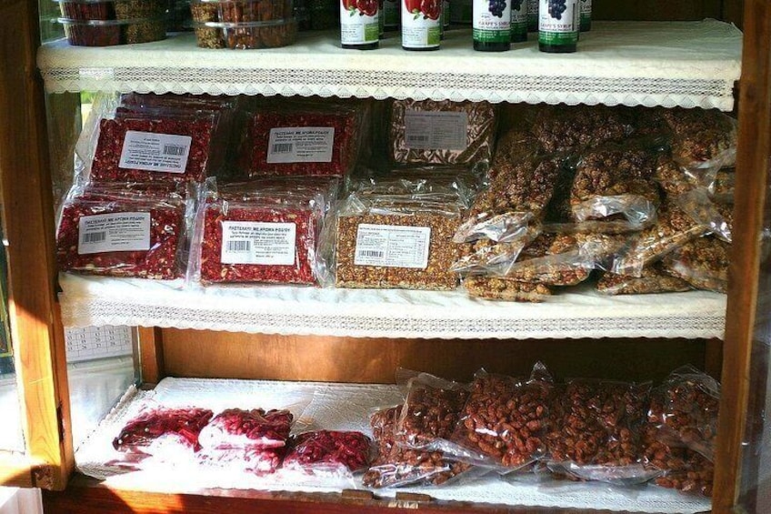 Shelves stocked with packaged food items, including dried fruits and granola bars. 2