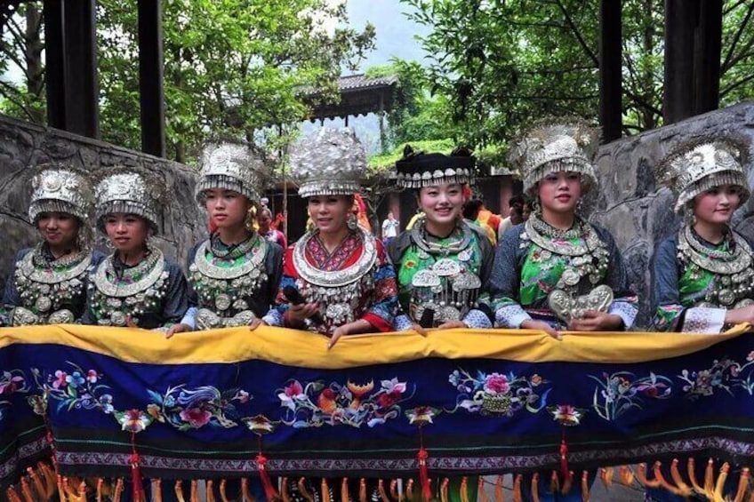 miao minority girl welcoming guests 1