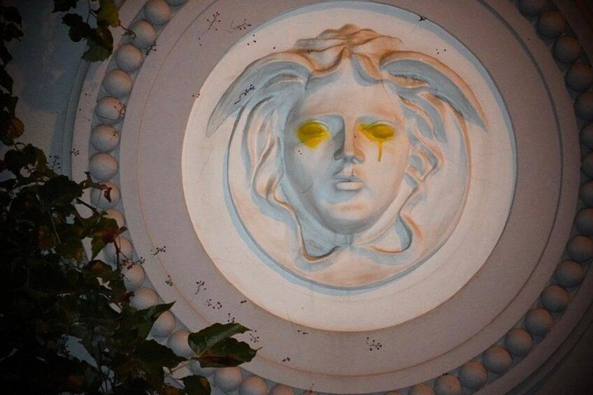 A circular architectural feature with a central relief sculpture. 4