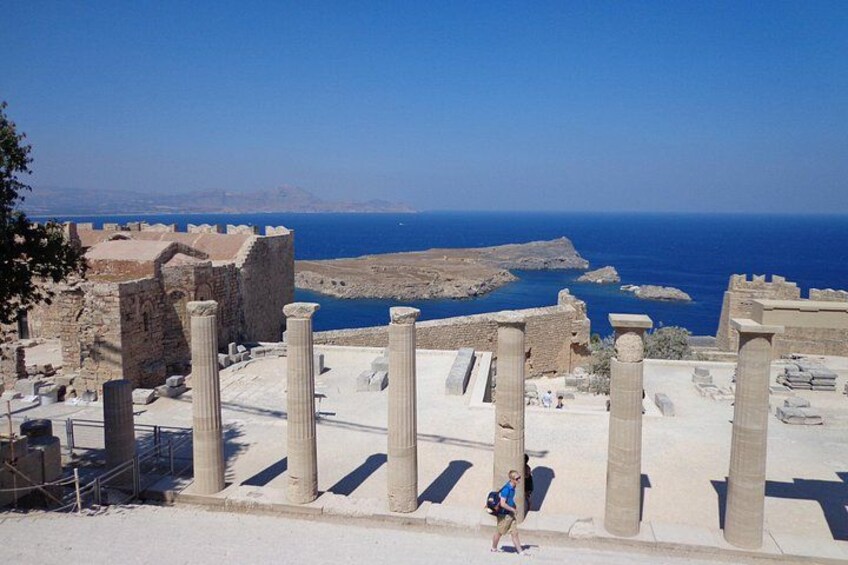 Ancient ruins with columns and a view of the sea. 2