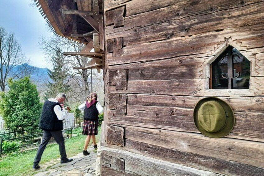 A wooden cabin with a window and a door. 1