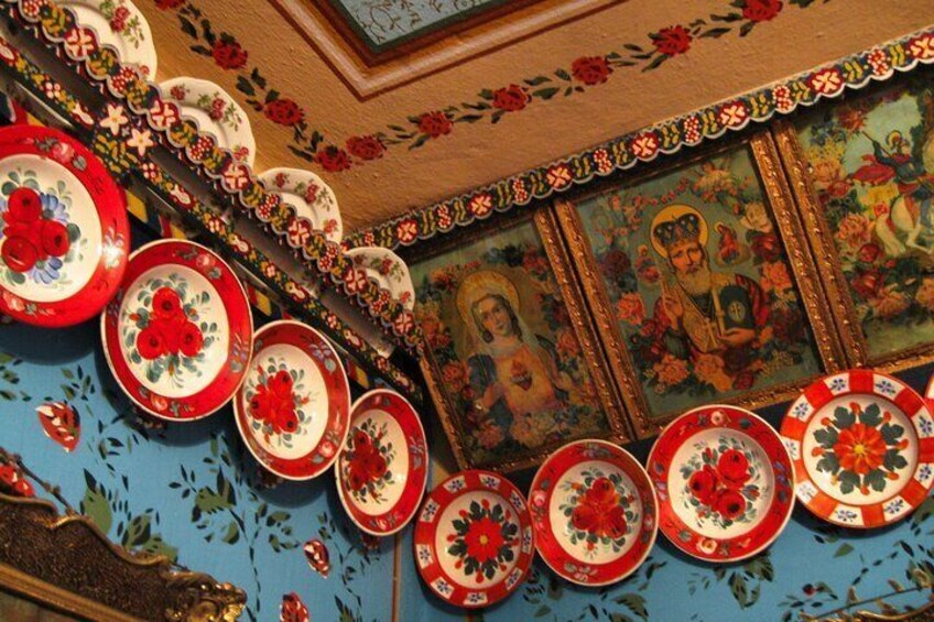 A ceiling with ornate decorations, including floral patterns and religious paintings. 4