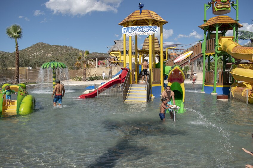 A water park with slides and water features, including a 'Wild Canyon' sign. 5
