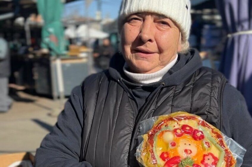 A person holding a wrapped gift. 3