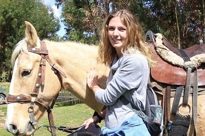A person sitting on a horse with a saddle. 2