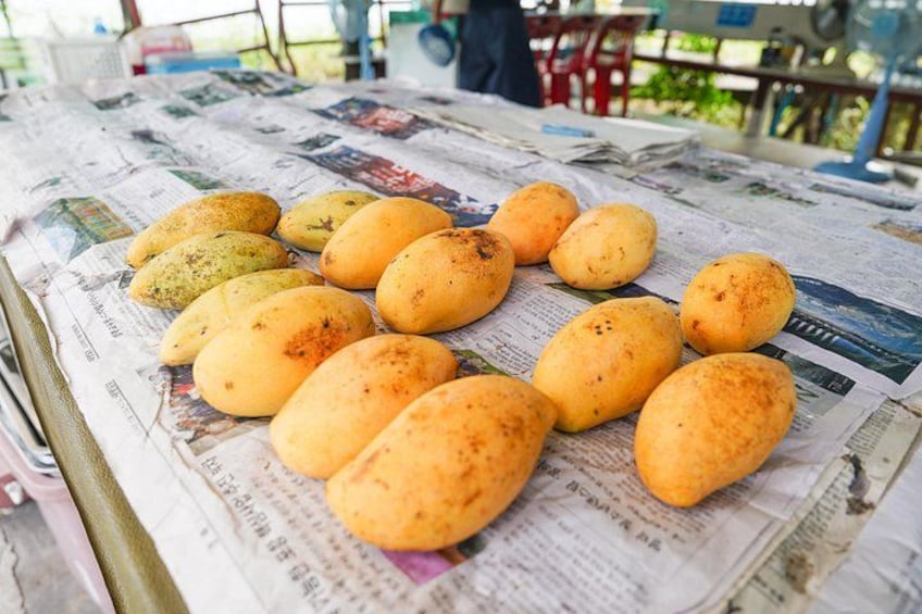A table with bread on newspaper. 5
