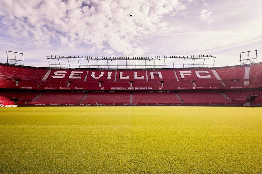 A football stadium with 'SEVILLA FC' written on the stands. 1