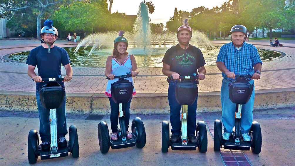 Tour group in front of a fountain at sunset on the Balboa Park Segway Tour in San Diego 