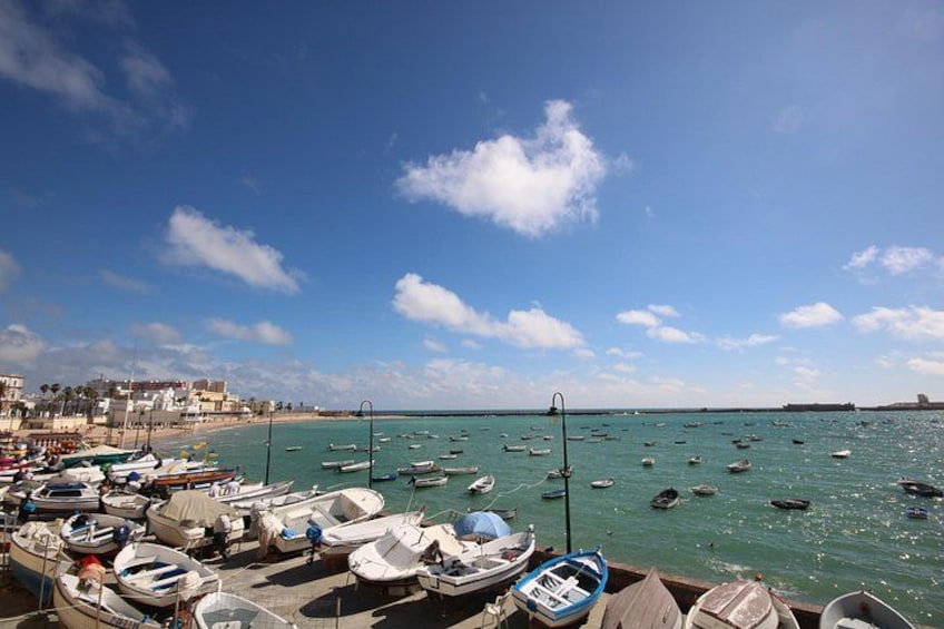 Stroll along La Caleta beach, Cadiz on this shore excursion 1