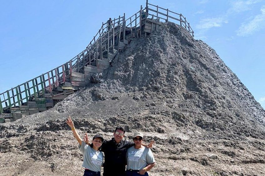 A rocky mountain with a wooden staircase leading to the top. 2