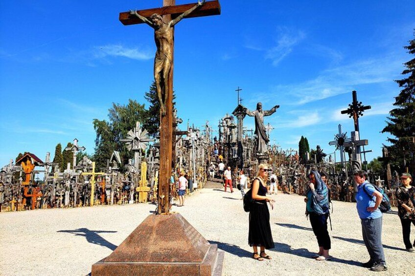 A large outdoor religious site with numerous crosses and statues. 1