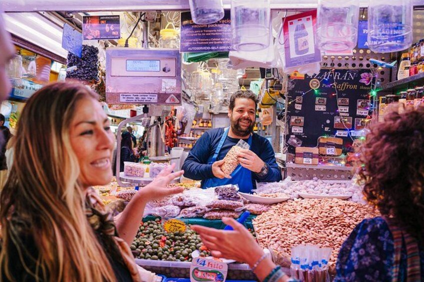 A market stall with various nuts and dried fruits. 3