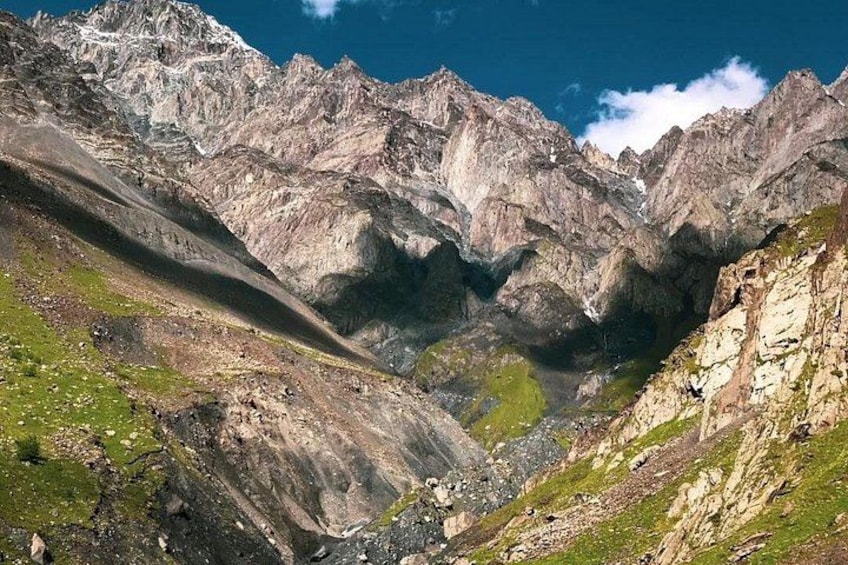 A mountainous landscape with rocky terrain and a valley. 2