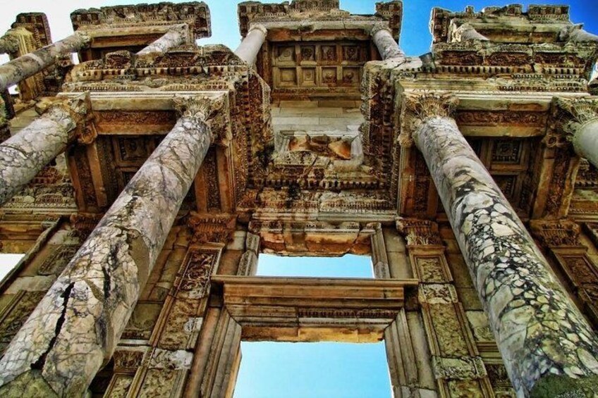 Ancient stone columns and intricate carvings of a historical temple. 2