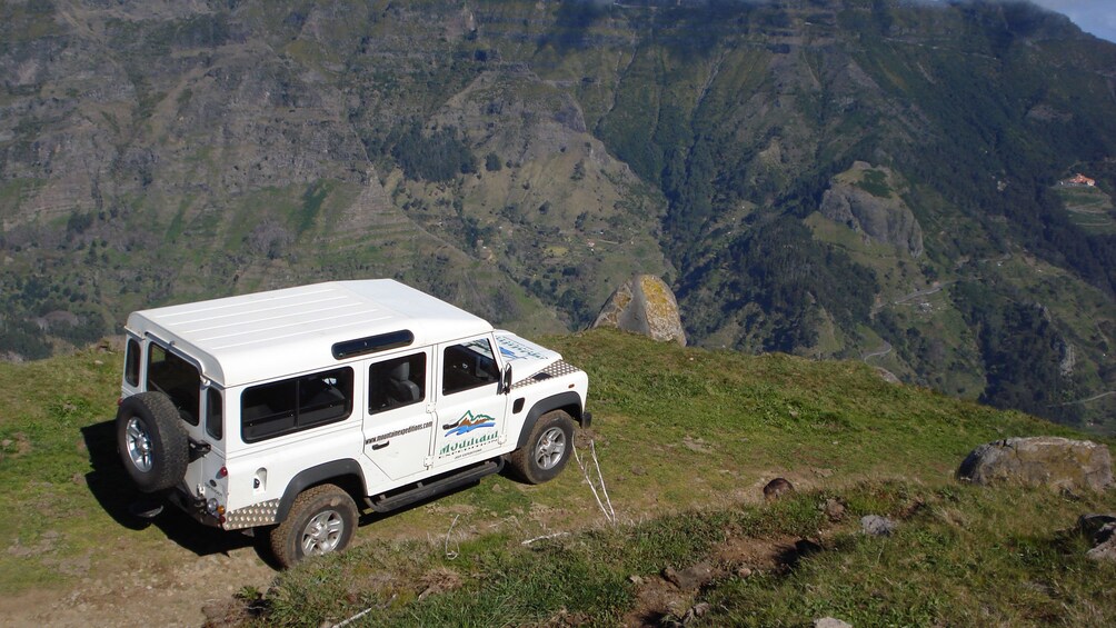 A Jeep parked at a scenic vista of Madeira