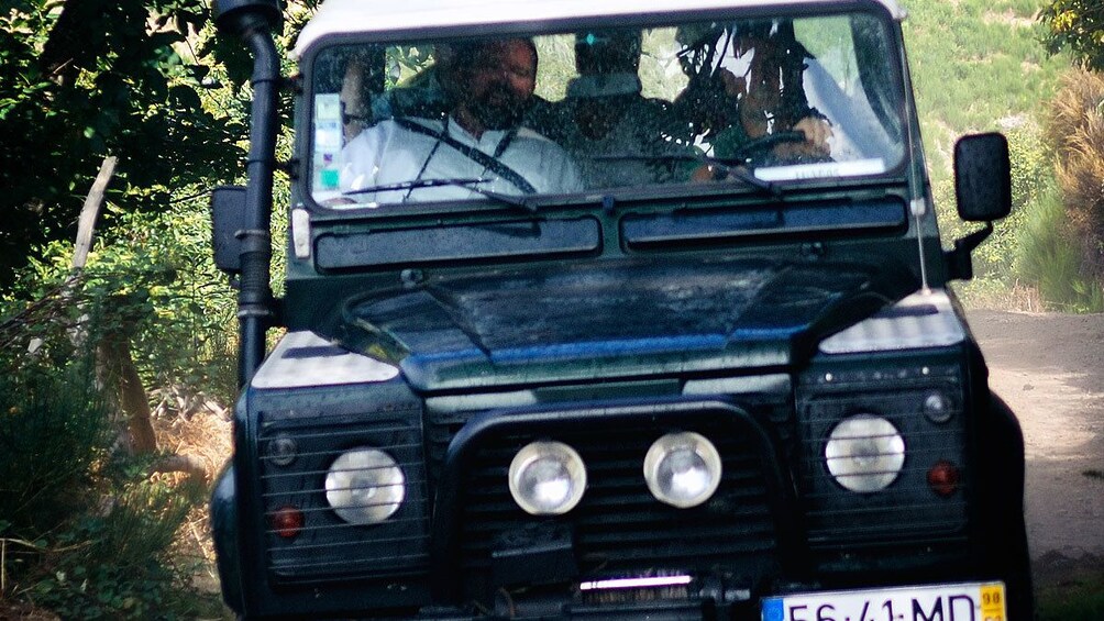 A jeep off roading in the jungle