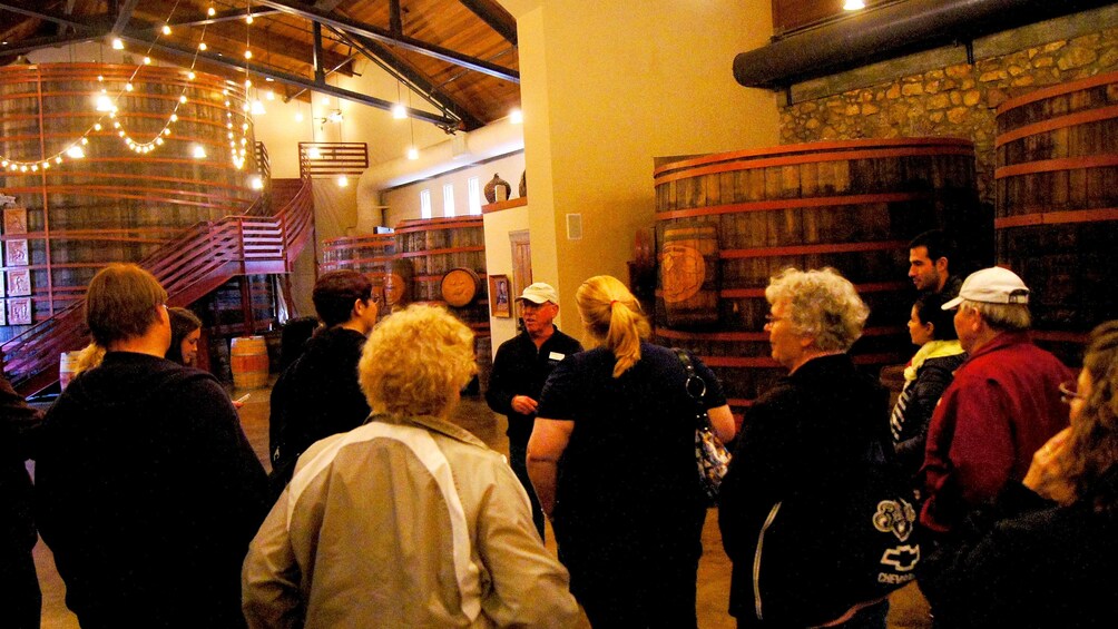 inside the well lit winery with large barrels in San Francisco