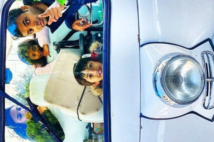 A vehicle interior with a child and an adult. 3