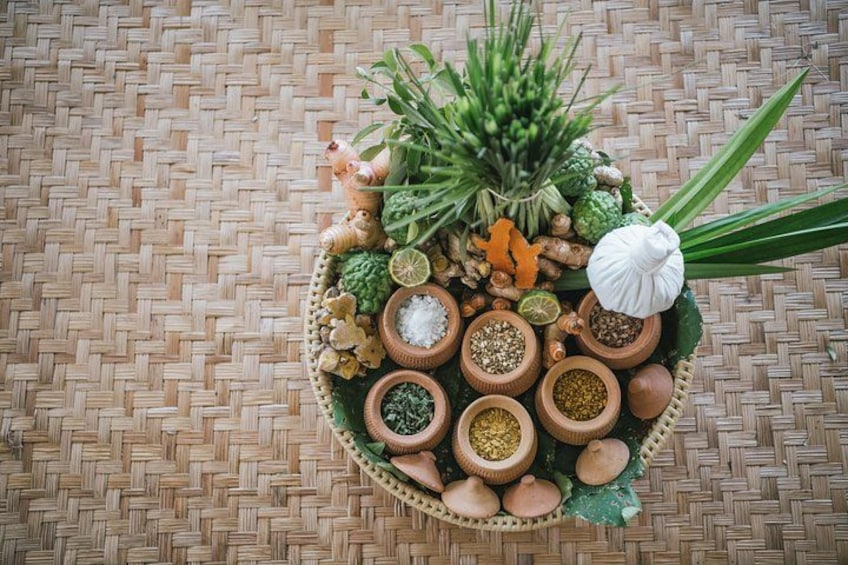 A woven mat, a basket with various spices and herbs, and a white object resembling a bulb. 3