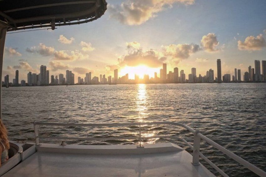 A sunset over a city skyline reflected on water. 5