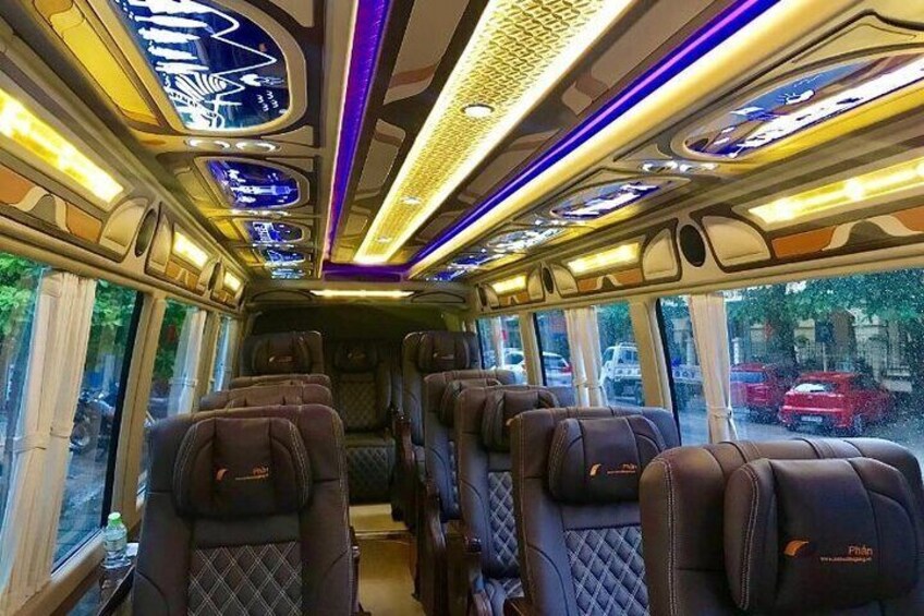 The interior of a train with leather seats and a modern design. 5