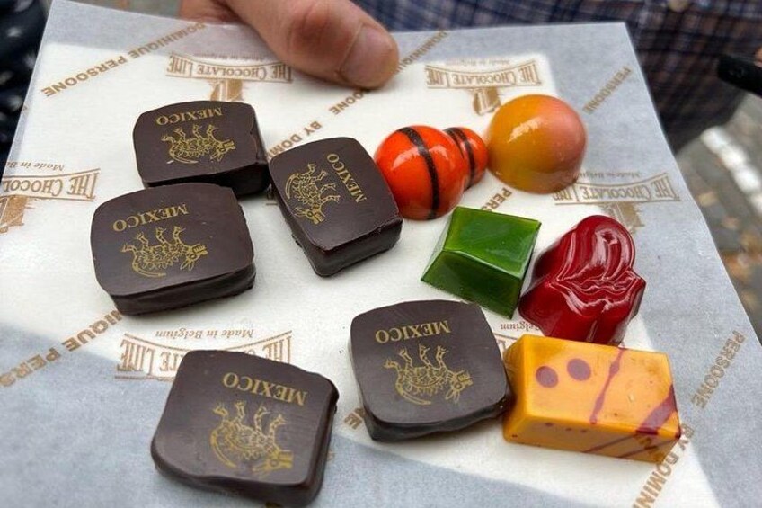 Various types of chocolate and a book with a Mexican theme. 2