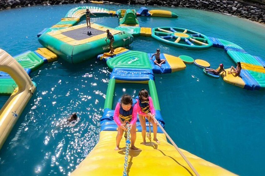 An inflatable water park with slides and pools. 5
