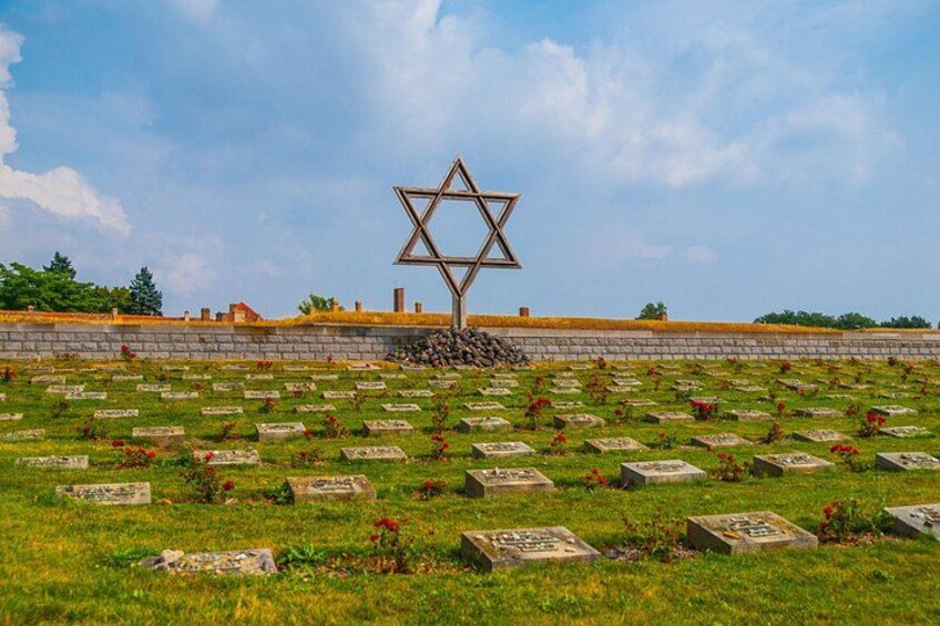 A cemetery with Star of David monuments and gravestones. 3