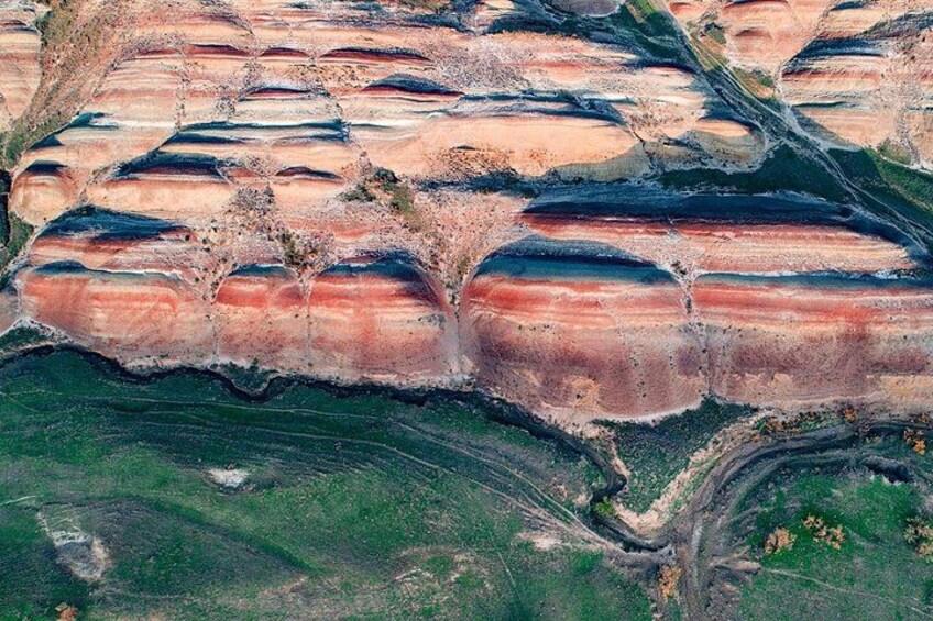 A geological formation with layered rock structures. 1