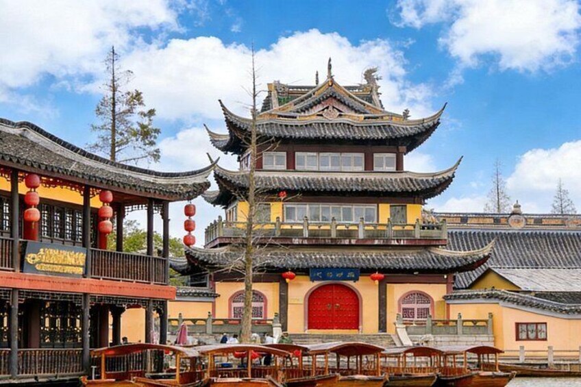 A traditional Chinese building with multiple tiers and red lanterns. 5