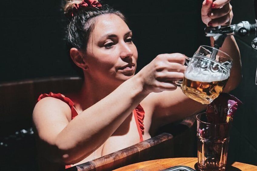 A person pouring beer into a glass. 2
